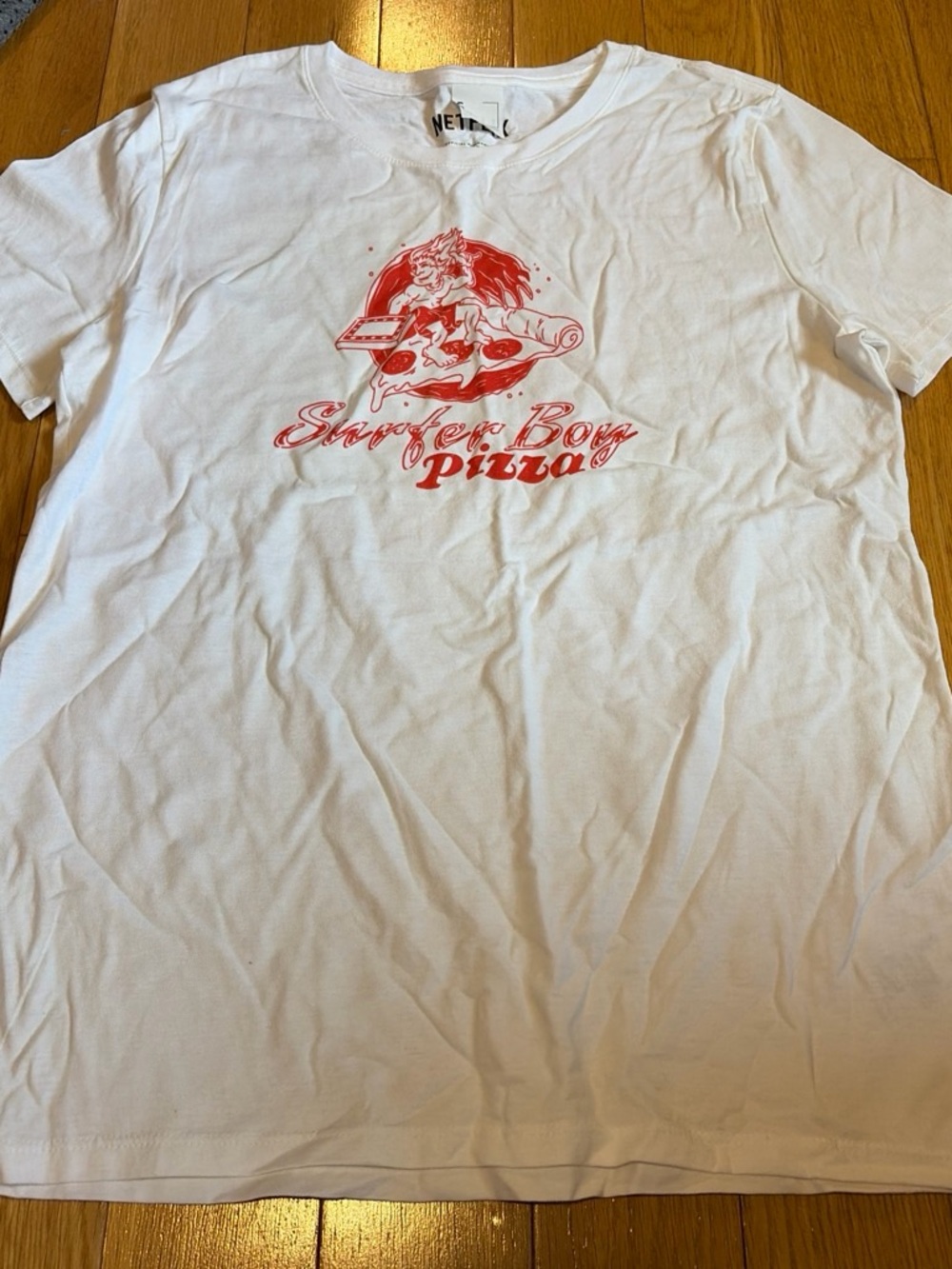 Netflix White Short Sleeve Tee with Red Surfer Boy Pizza Graphic